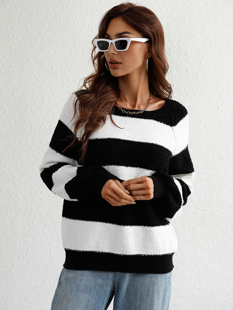 Graham Knit Top is a classic long sleeve striped sweater with a round neck, ribbed trim, and a thick striped pattern.