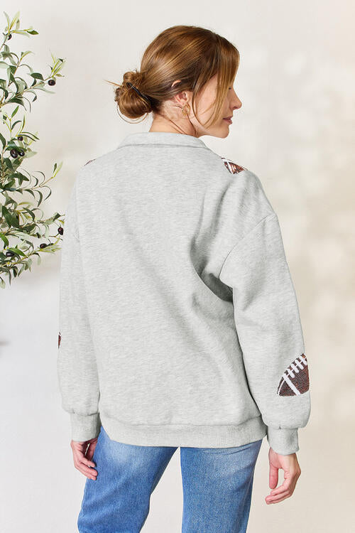 Ellen Double Take Full Size Sequin Football Half Zip Long Sleeve Sweatshirt