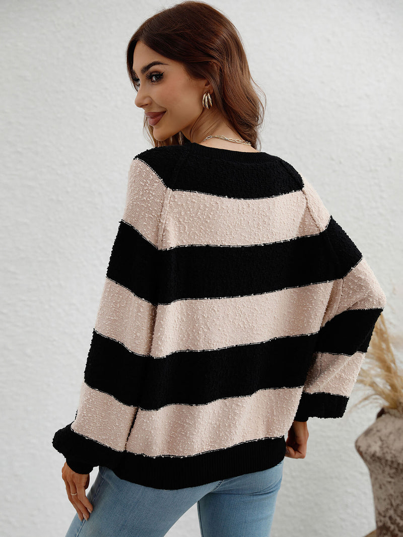 Graham Knit Top is a classic long sleeve striped sweater with a round neck, ribbed trim, and a thick striped pattern.
